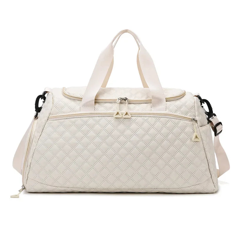 Quilted beige duffel bag on a white background