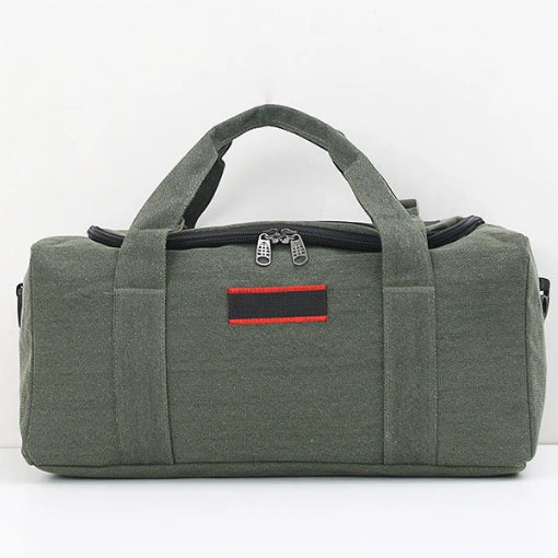 Green duffel bag with a red label on a white background