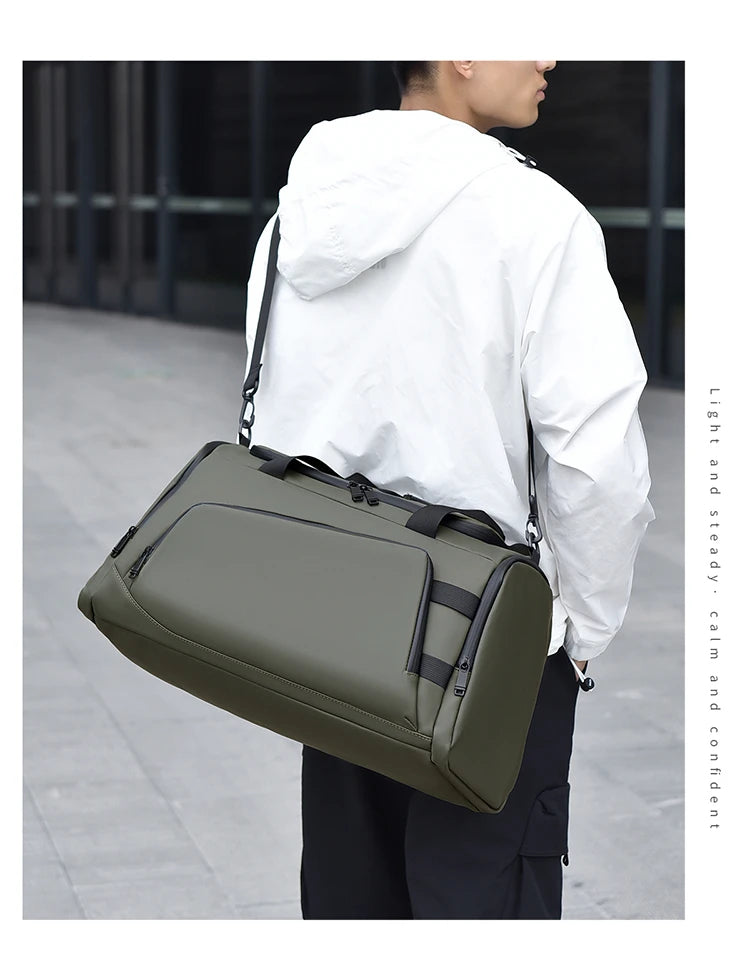 Person carrying a green duffel bag on a blurred background