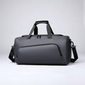 Gray duffel bag with black straps on a white background