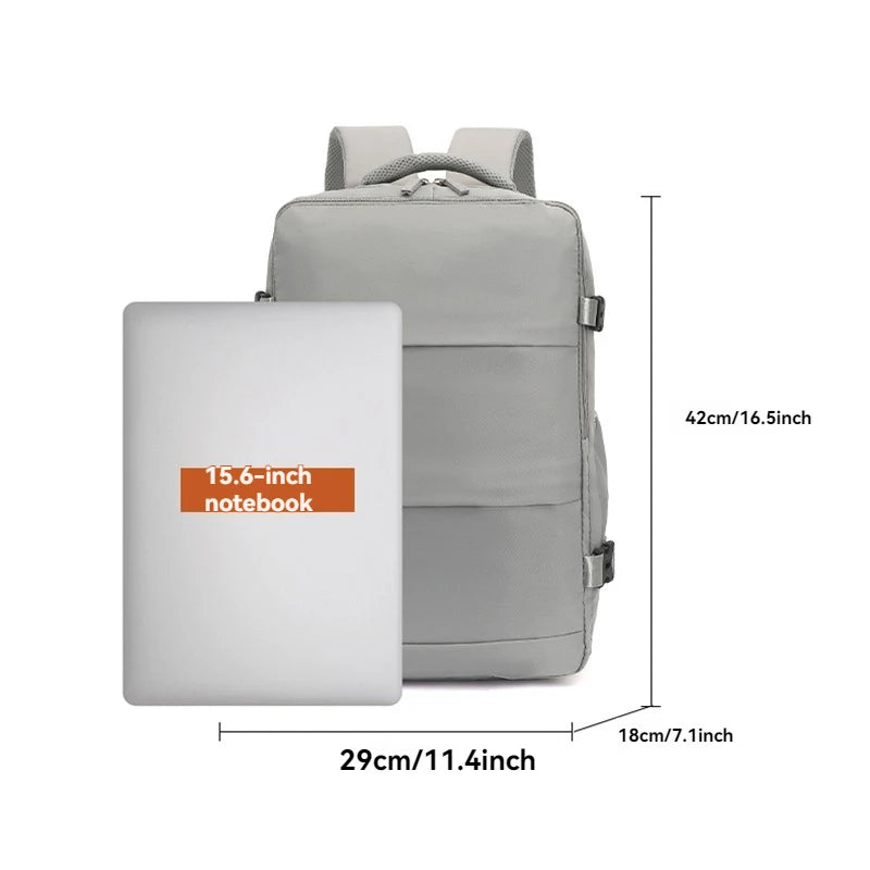 Gray backpack with dimensions and a 15.6-inch notebook for scale on a white background