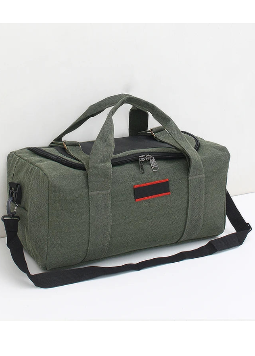 Green duffel bag with a red and black label on a white background