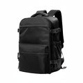 Black backpack with multiple straps on a white background