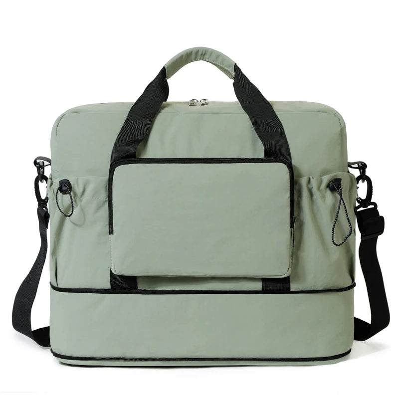 Light green travel bag with black straps on a white background