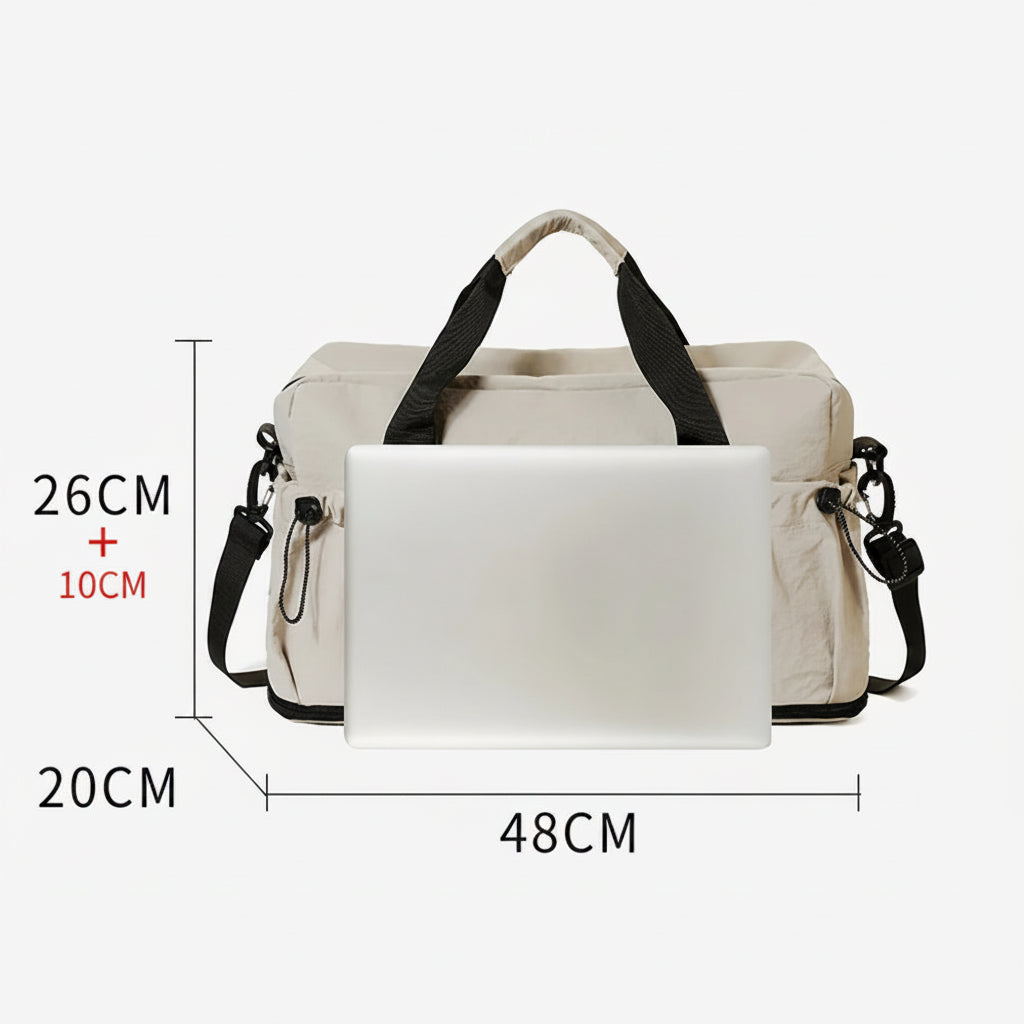 Beige handbag with black straps and measurements on a white background
