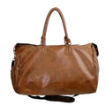 Brown leather duffel bag on a white background