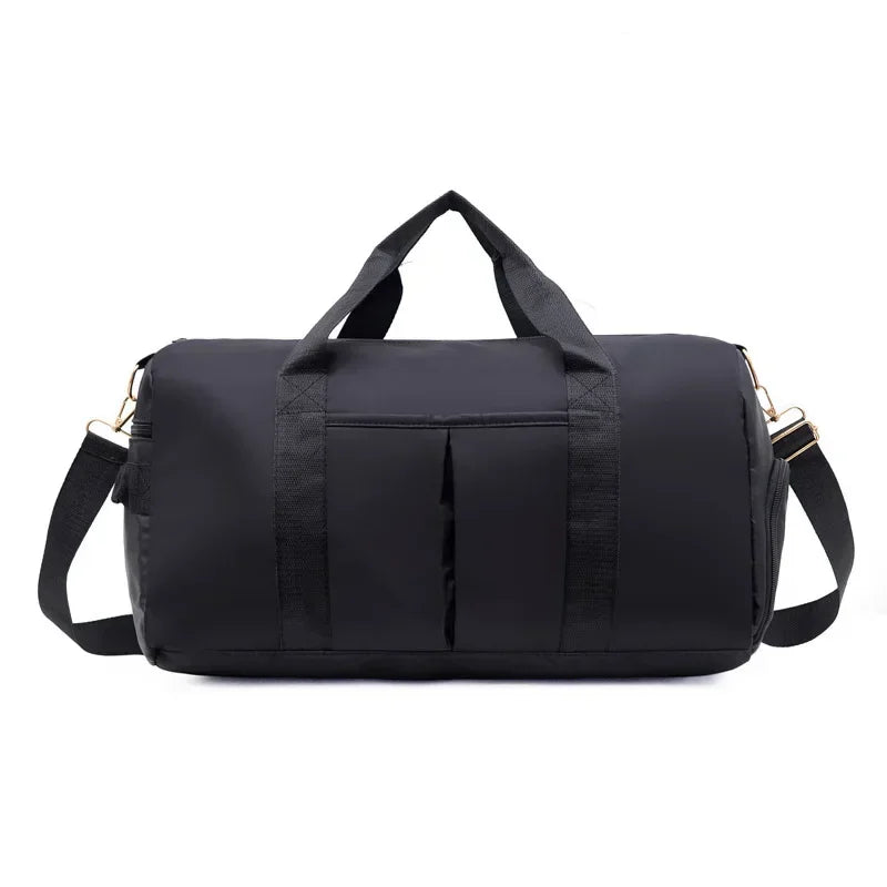 Black duffel bag with gold zippers on a white background