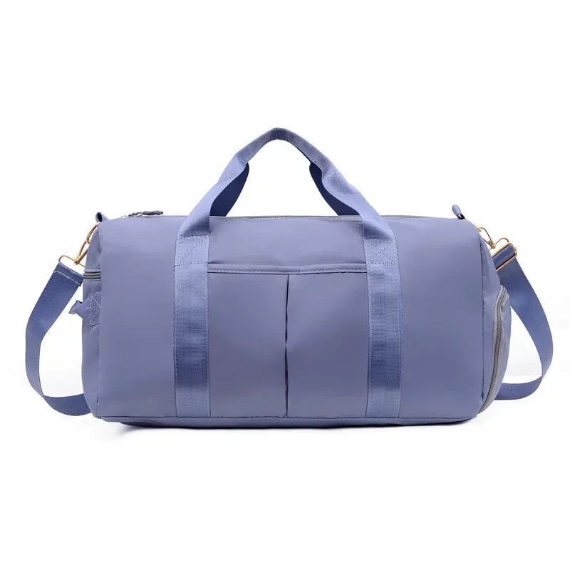 Purple duffel bag with a shoulder strap on a white background