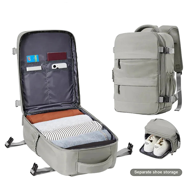 Gray travel backpack with open compartment showing organized items on a white background.
