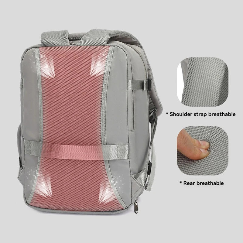 Gray backpack with pink interior, showing breathable shoulder strap and rear design on a light gray background.