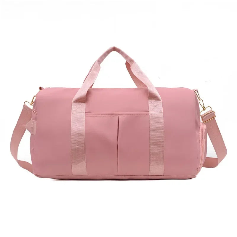 Pink duffel bag with straps on a white background