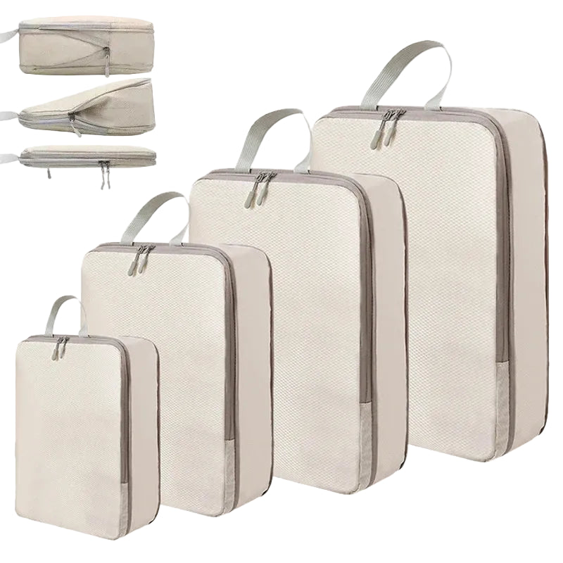 Set of beige travel packing cubes in various sizes on a white background
