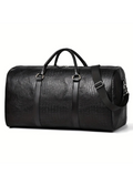 Black leather duffel bag with crocodile texture on a white background
