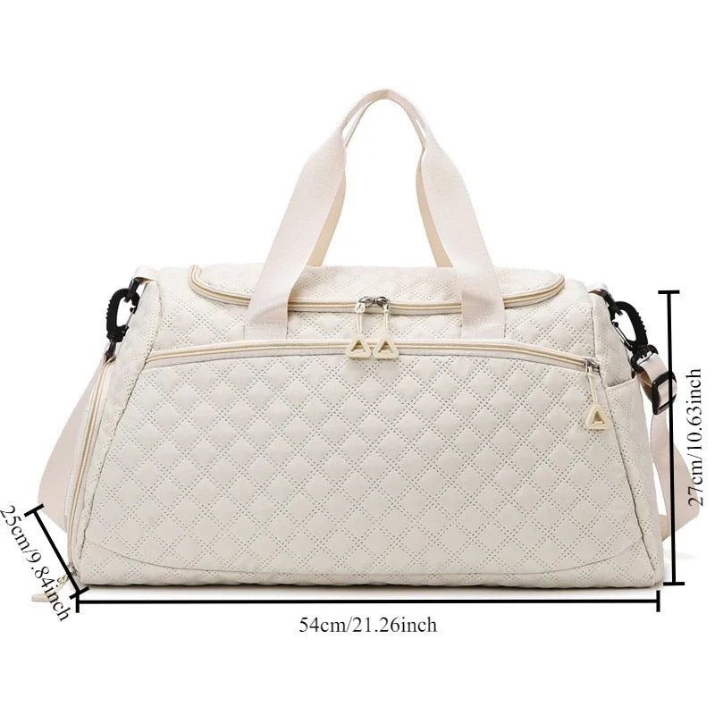 White quilted duffel bag with measurements on a white background